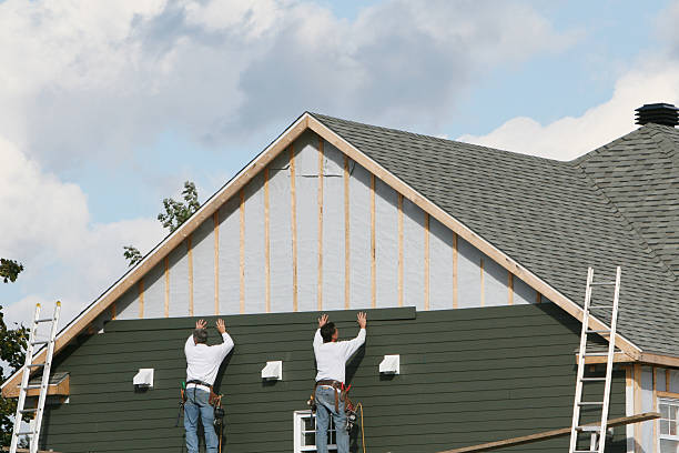 Professional Storm Damage Siding Repair technician working in Point Pleasant, WV